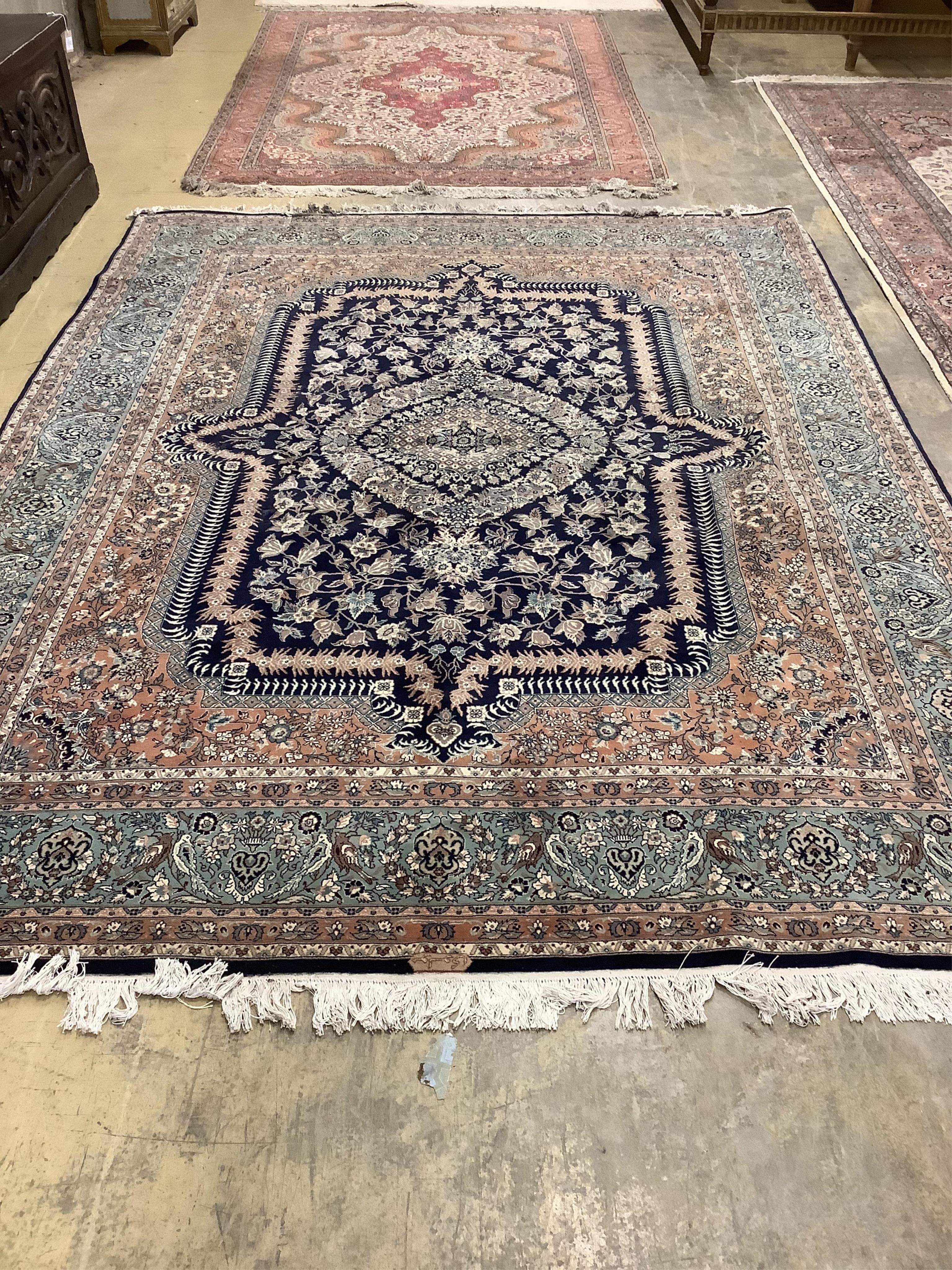 An Isfahan design blue ground rug, 330 x 250cm. Condition - good